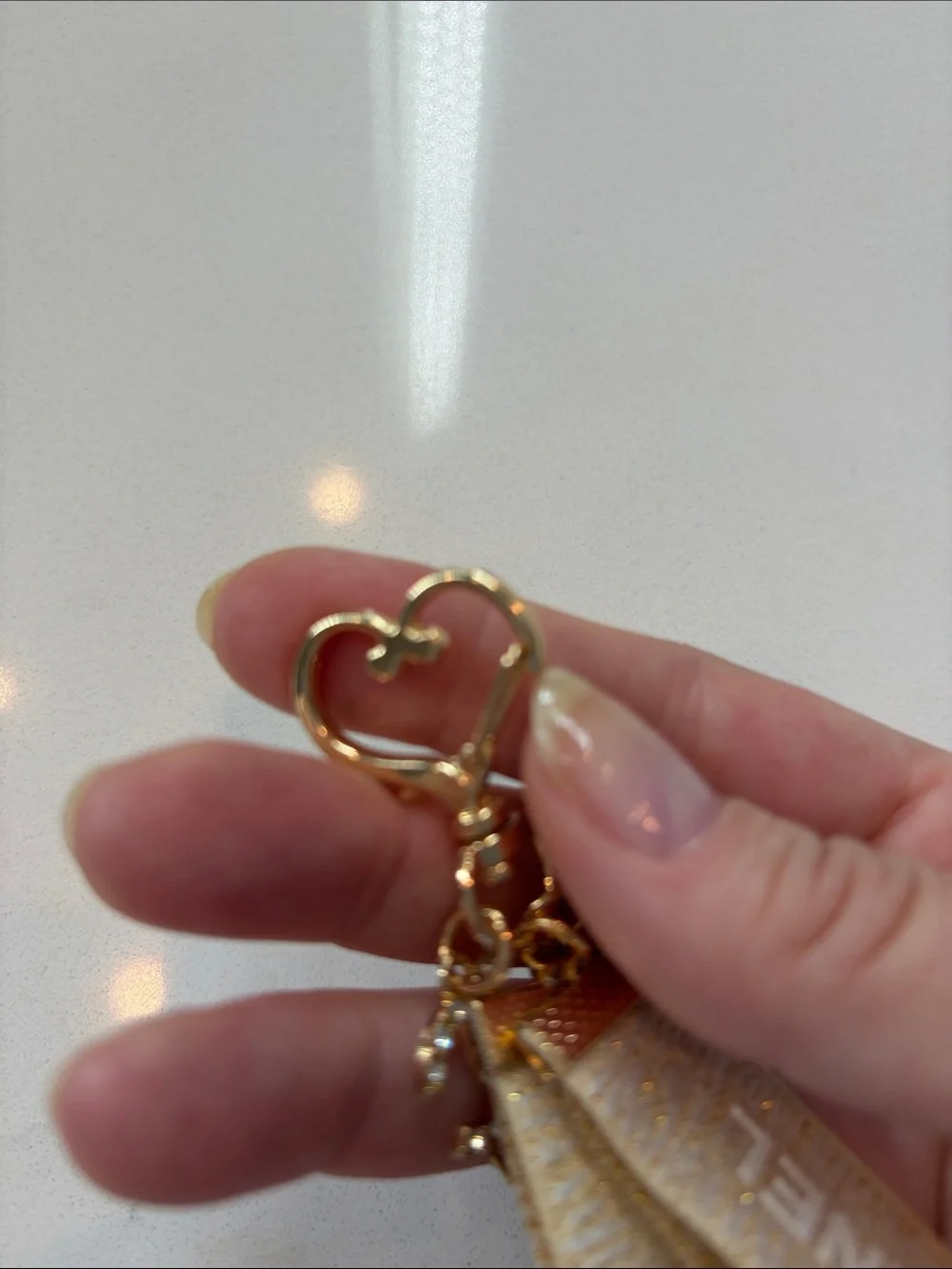 Beige and Gold Logo Strap Keychain with Charms